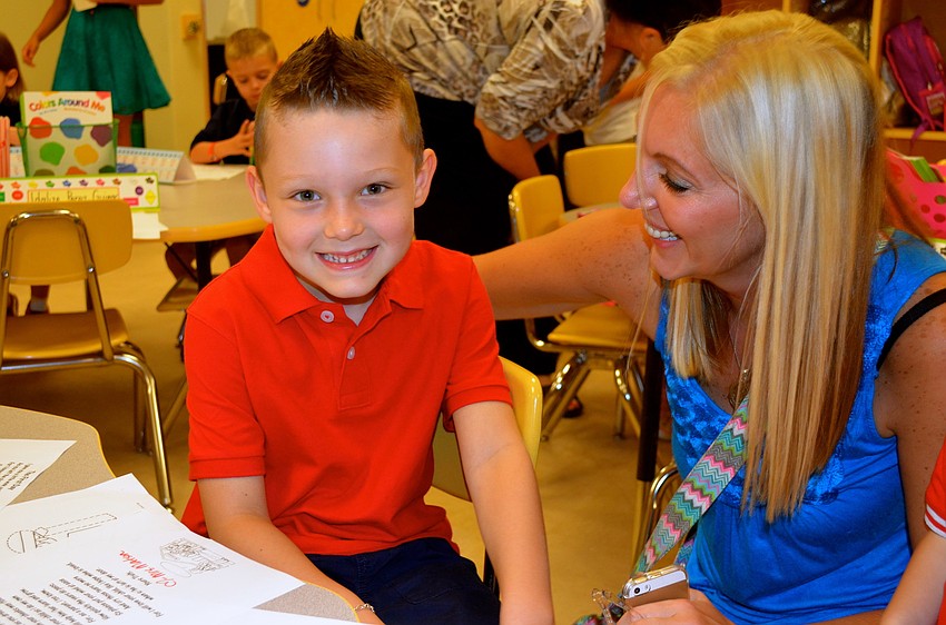 Brandon Gallaway is all smiles on his first day as he talks with his mother, Gemma.