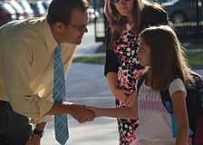 Bay Haven Principal Chad Erickson greets Jennifer and Jocelyn Black.
