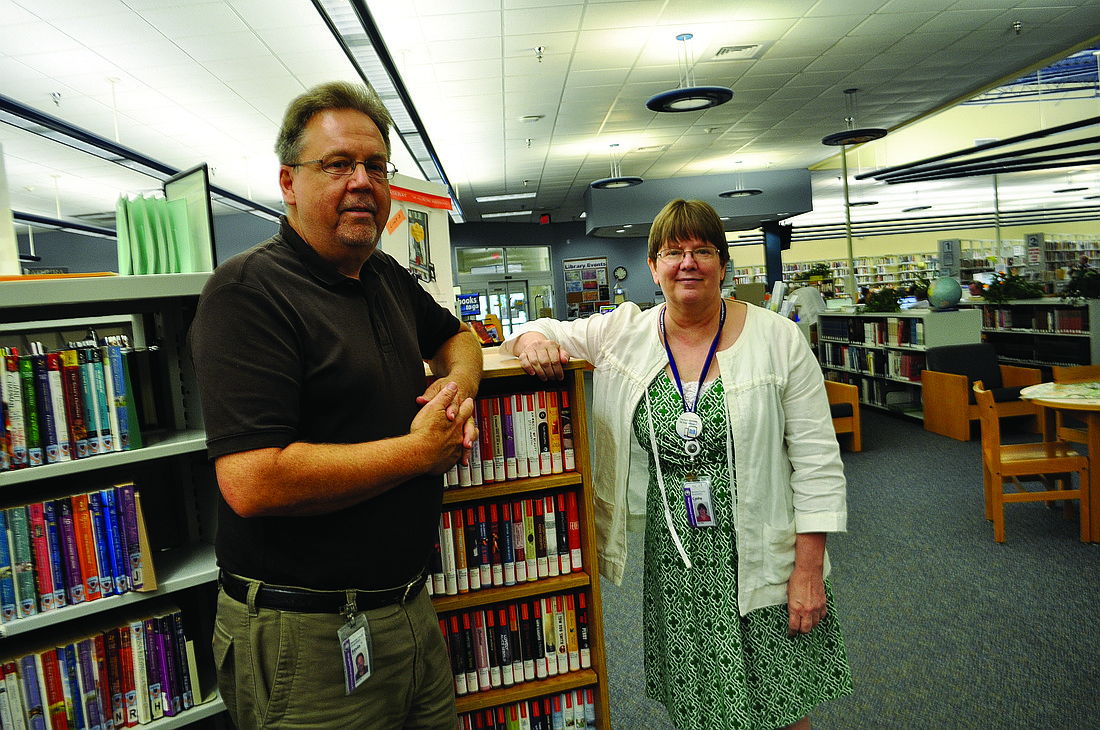 Kevin Beach, operations manager for the county's library system, and Braden River Branch Library Supervisor Cathy Laird say the Braden River Branch Library is the busiest library in Manatee County. Photo by Pam Eubanks