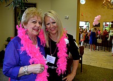 B.J. Burnside and Carol Banach show off their pink attire.