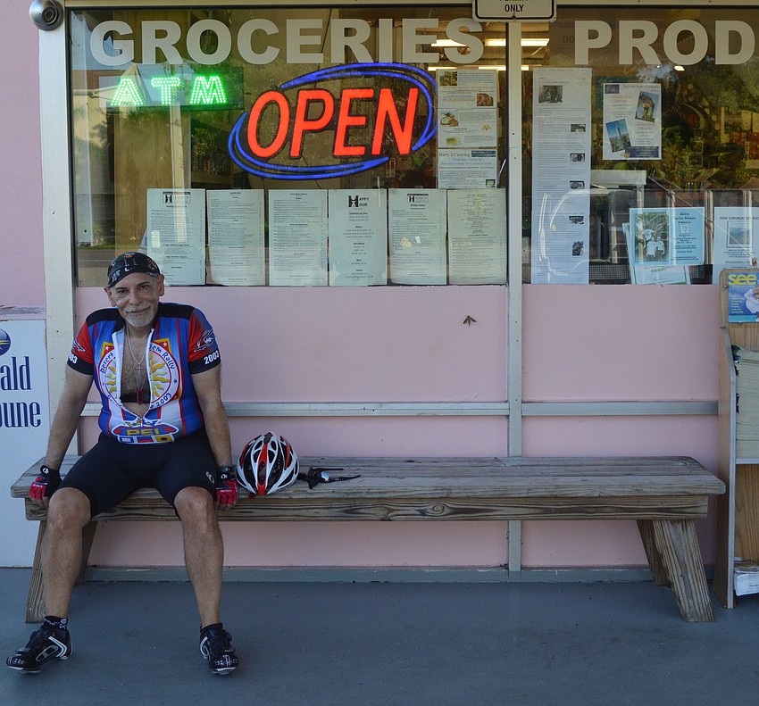 Joseph Formoso takes a break at Harry's Corner Store, his turnaround point, during a bike ride from Anna Maria Island.