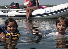 Rio and Kaleb Rice found scallops while searching the grasslands with their parents.