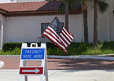 Renee Sheade votes at the Municipal Auditorium.