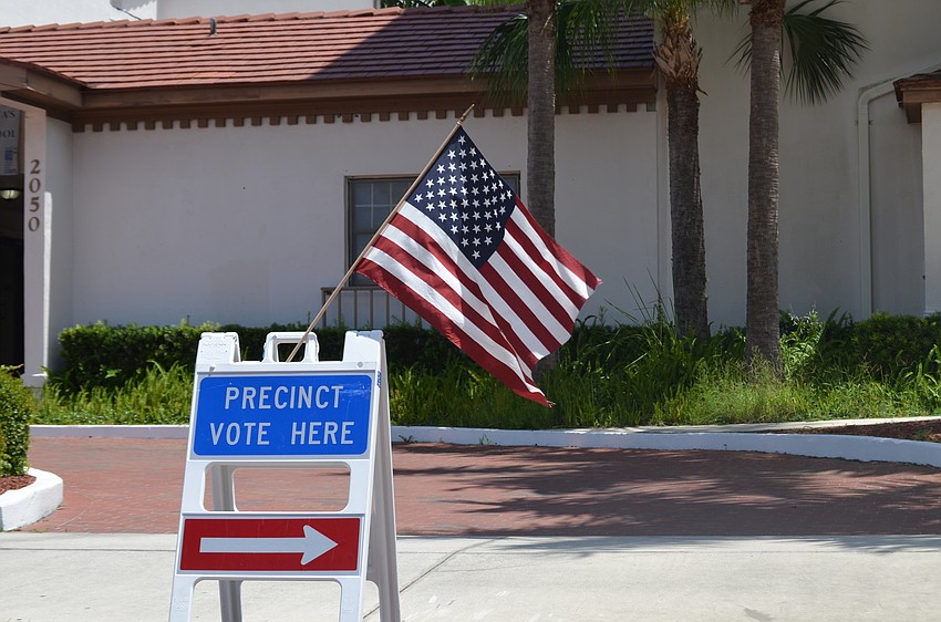 Renee Sheade votes at the Municipal Auditorium.