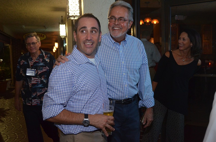 County Commission District 2 candidate Paul Caragiulo celebrates his win with departing County Commission Joe Barbetta.