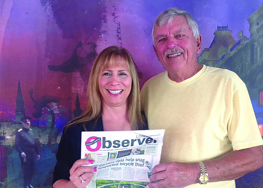 CRUISE NEWS. Leslie and Tom Cail enjoy reading their Longboat Observer on a recent cruise from St. Petersburg, Russia, to Moscow.