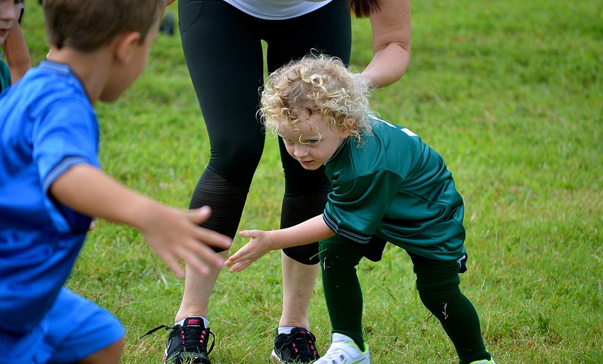 Gabriel Kompothecras focuses on the ball and his competition.