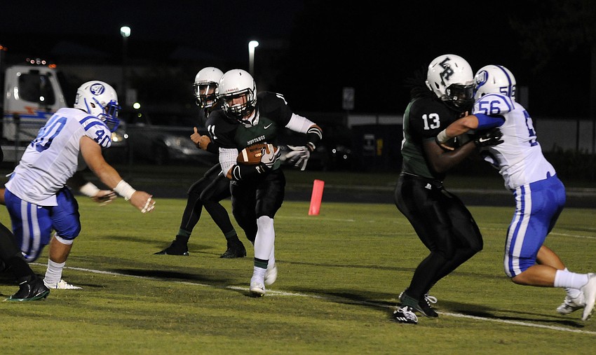 Lakewood Ranch running back Justin Fischer carries the ball in the first quarter.