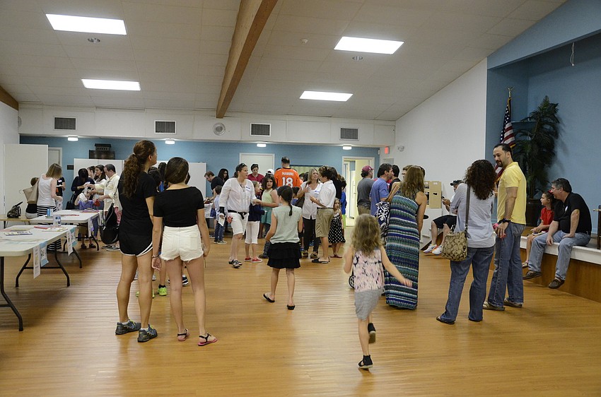 Families attending the religious school at Temple Emanu-El mingled and met with class teachers Sunday at the orientation.