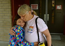 Mia Merrell hugs her grandmother, Marilyn Buxton, goodbye after lunch.