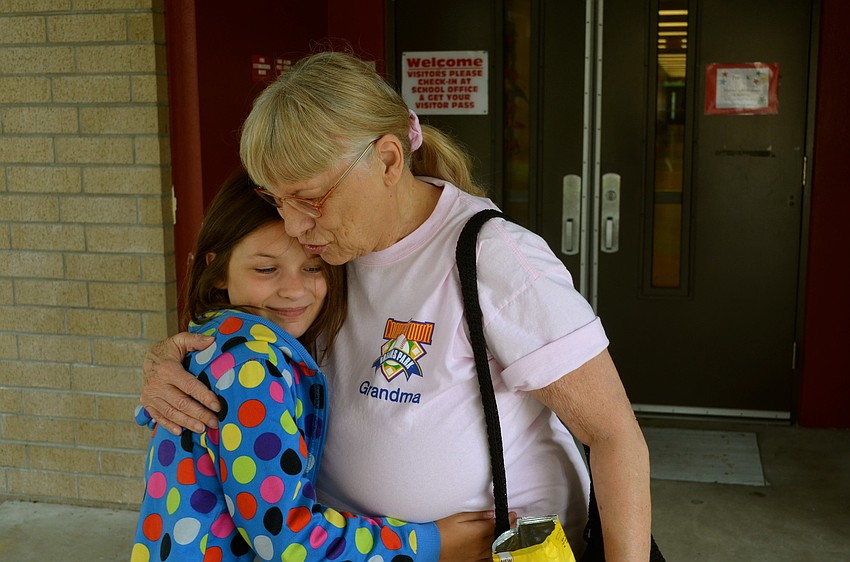 Mia Merrell hugs her grandmother, Marilyn Buxton, goodbye after lunch.