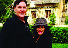 FRENCH CONNECTION. Bernard and Lauren Walsh enjoyed catching up on their Longboat Observer news while touring Marie Antoinette's estate on the grounds of the Palace of Versailles. The Walshes also enjoyed sightseeing in Paris.