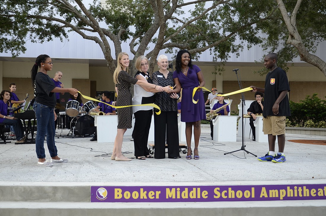 School Board members Bridget Ziegler, Shirley Brown, Caroline Zucker and Booker Middle School Principal LaShawn Frost cut the ribbon for the new amphitheater. Photos by Jessica Salmond