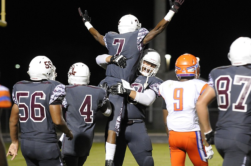 Braden River wide receiver Justin Ross celebrates with his teammates following his 16-yard touchdown catch in the third quarter.