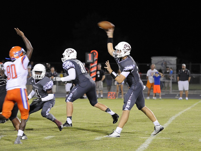 Braden River junior quarterback Jacob Huesman drops back for a pass in the second half.