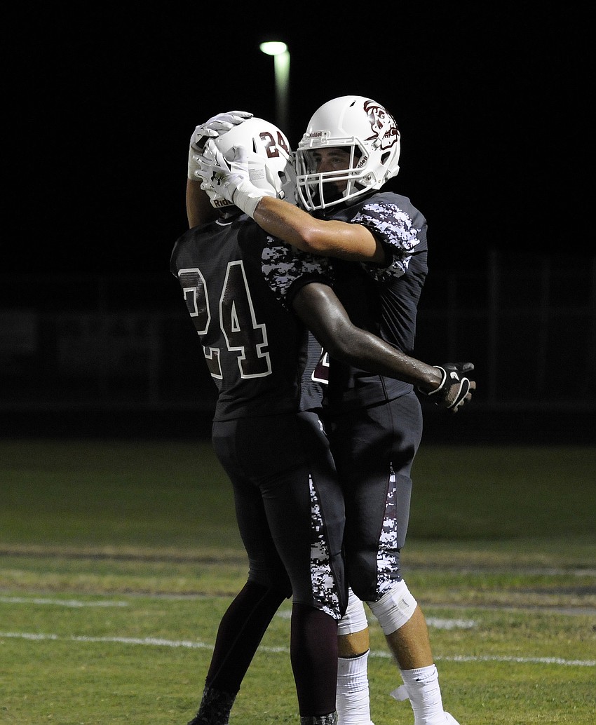 Carlos Crawford and Travis Williams celebrate following Williamsâ€™ touchdown catch.