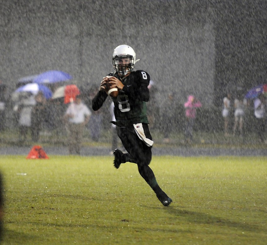 Lakewood Ranch quarterback Chad Rex rolls out of the pocket in the first quarter.