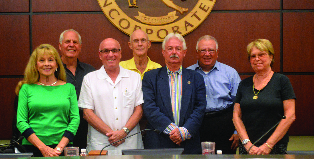 Commissioners Lynn Larson and Irwin Pastor, Vice Mayor Jack Duncan, Commissioner Phill Younger, Mayor Jim Brown and commissioners Terry Gans and Pat Zunz. Photo by Caleb Motsinger