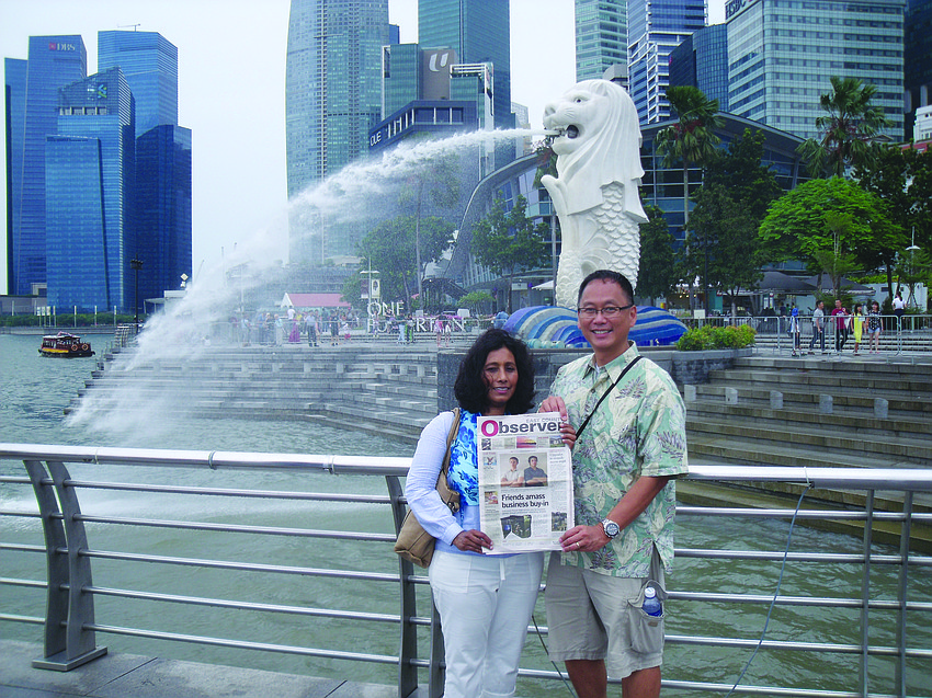BREEZY TRIP. Tara residents Jay and Paul Khoo enjoy the breeze and spray at Merlion Park in Singapore.