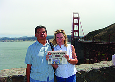 GOLDEN HOUR. Pete and Martha Mirande catch up on their Observer news while visiting family and friends in San Francisco.