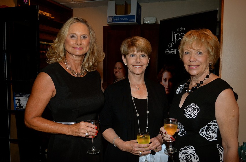 Linda Ozley, Pam Griffith and Nancy Maher enjoy wine.