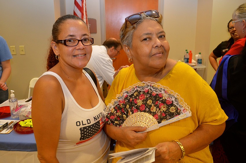 Lisandra Pellicier and Carmen Soto check out the expo's booths.