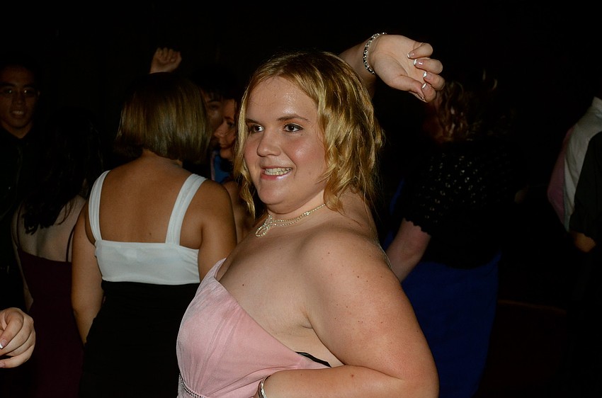 Brianna Farnsworth dances with her friends.