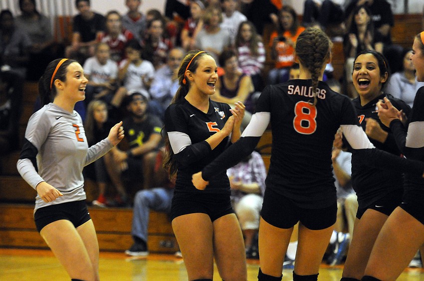 Jessica Shiffner and the rest of the Sarasota volleyball team celebrate a point during their rivalry match versus Riverview Sept. 29.