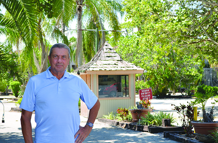 Manfred Welfonder stands in front of the shuttered Colony Beach & Tennis Resort, where he used to play tennis. Photo by Robin Hartill
