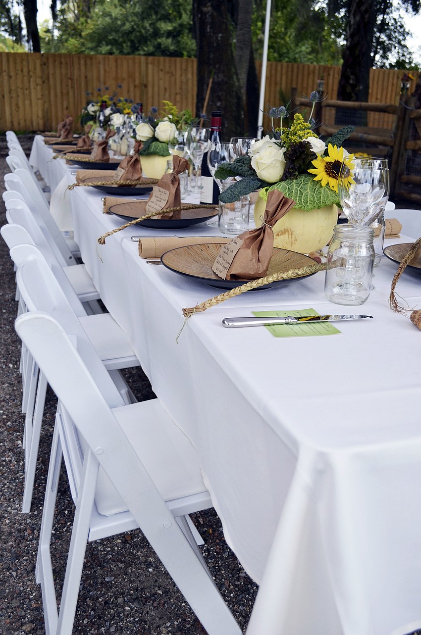 A table set for 14 guests was set up at Sweetgrass Farms for the Maison Blanche Farm to Fork lunch event.
