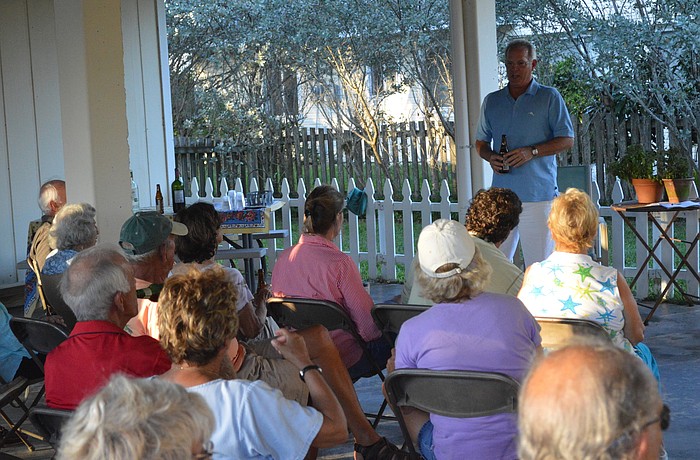 Longbeach Village Association President Michael Drake speaks a crowd of nearly forty people about the town's proposed changes in parking.