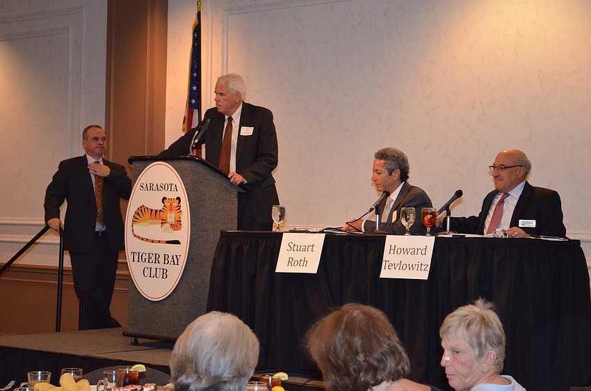 Dan Bailey introduces moderator Frank Alcock.