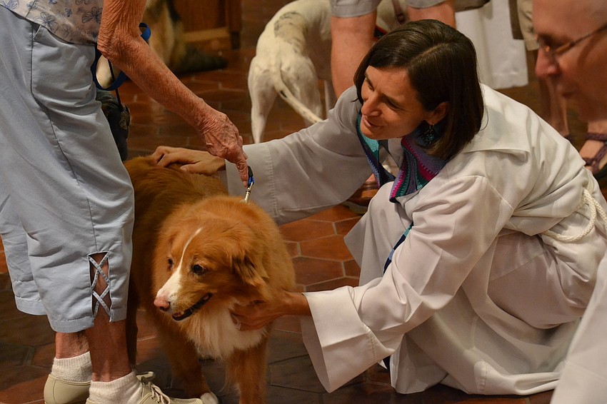 Associate Rector Andi Taylor conducts blessings at the St. Boniface Pet Blessing.