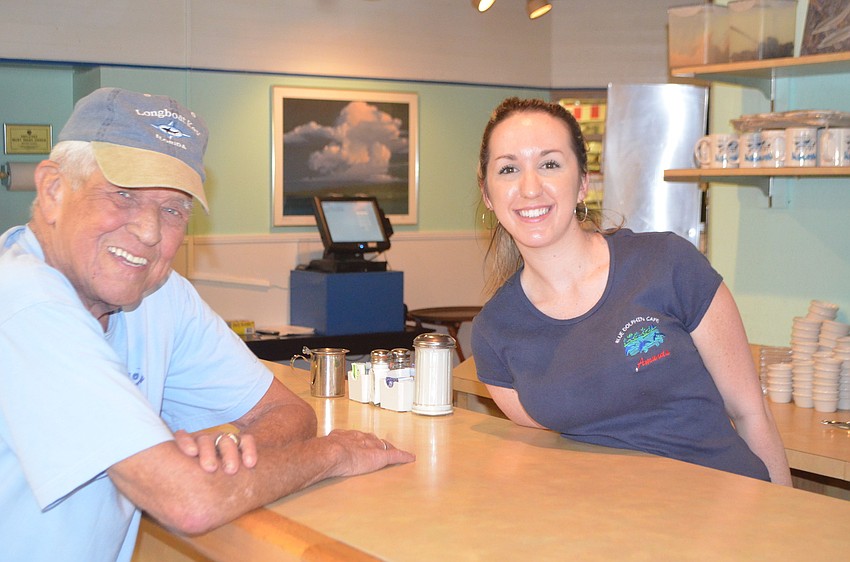 Amanda Paine serves Bill Schweitzer at Blue Dolphin Cafe. Schweitzer spends half his year in Germany and returned to Longboat Key last week.