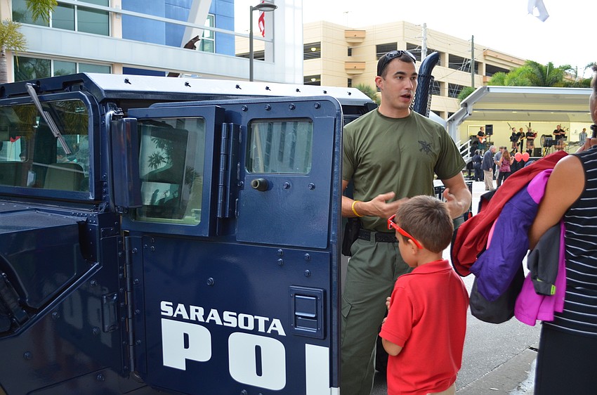Officer Gregory Miller gave tours of the Sarasota Police armored search and rescue vehicles.