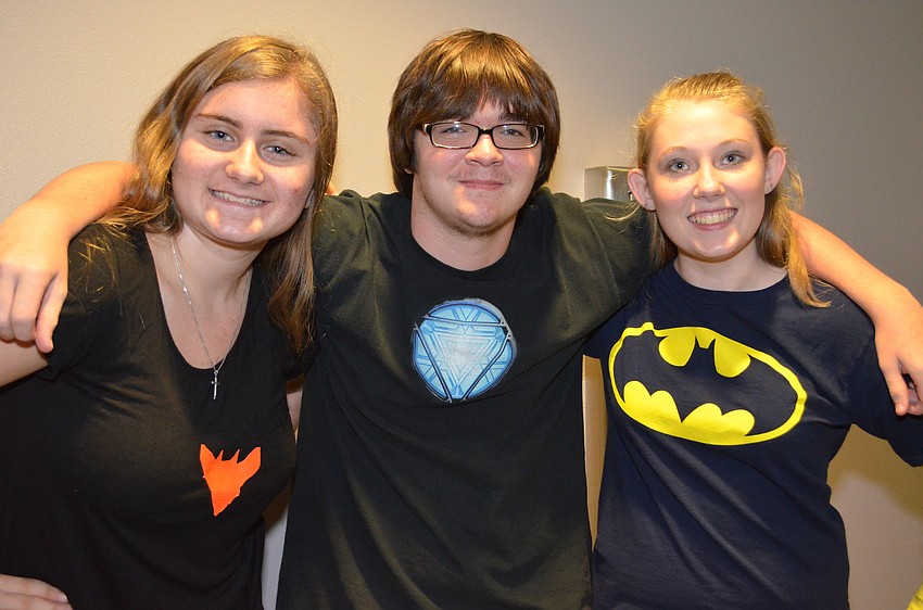 Sara Salanowski, Anakin Brooks and Keota Holroyd sport their favorite superheroes on their t-shirts.