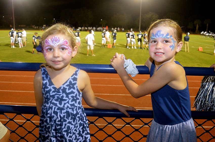 Liza Friedman and Avary Hollingsworth show off face paint at the game.