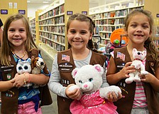 Meredith Carroll, Abbi Geiger and Lilly Irelan made sure to bring their favorite stuffed animals for the sleepover at Selby Library.