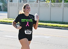 Destiny Bonner runs the Phillippi Shores 7K Run Saturday morning.