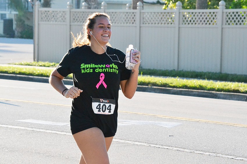 Destiny Bonner runs the Phillippi Shores 7K Run Saturday morning.