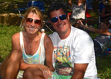 Eileen and Scott Lubore find a spot in the shade to listen to live music.