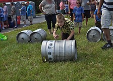 Treigh Wilkes tests his skills in the keg stack competition.