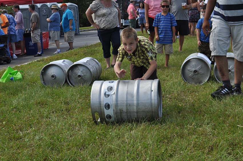 Treigh Wilkes tests his skills in the keg stack competition.