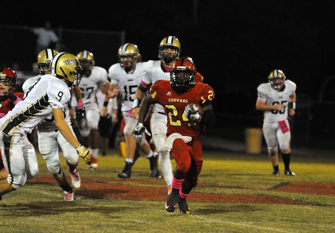Cardinal Mooney running back Jaz Mongeon, left, carried the ball six times for 124 yards and two touchdowns in the CougarsÃ¢â‚¬â„¢ non-district win.