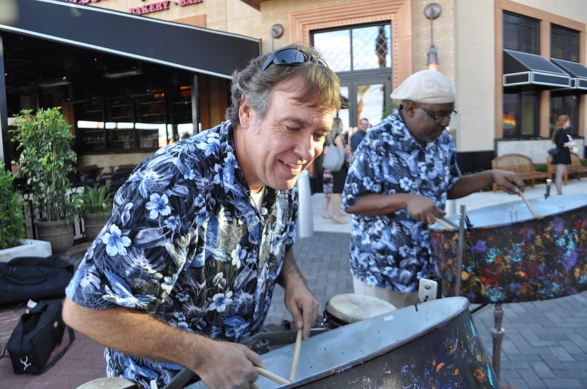Mark Jenkins plays the steel drum at the mall's main entrance.