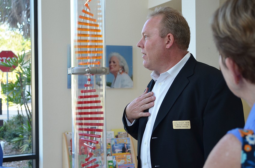 Executive Director, Doug Staley welcomes guest to the Child Protection Center for the Pillar of Hope Tasting and Awareness open house.