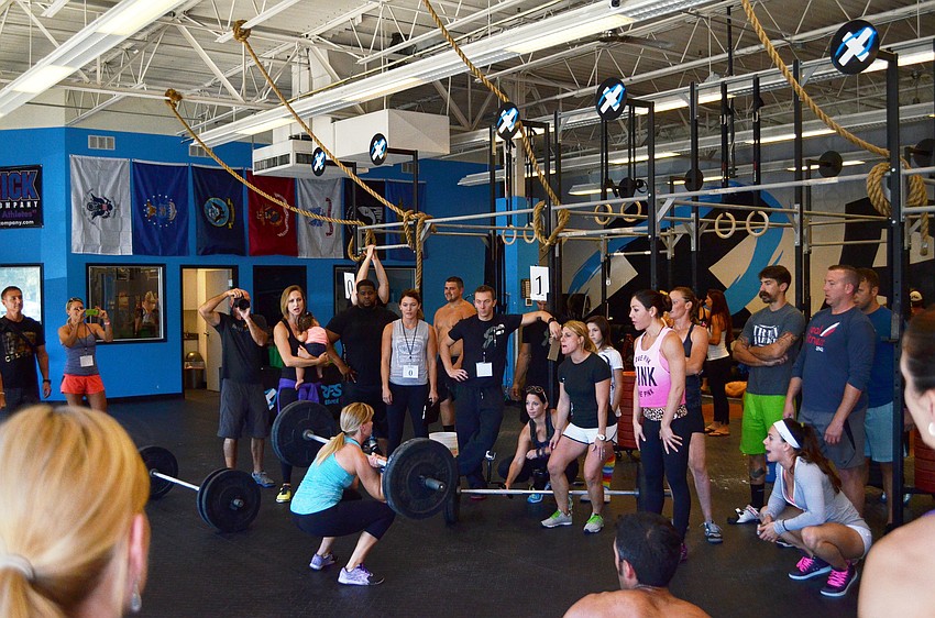 A crowd gathers to support Shea Dotson as she finishes her workout for the competition.