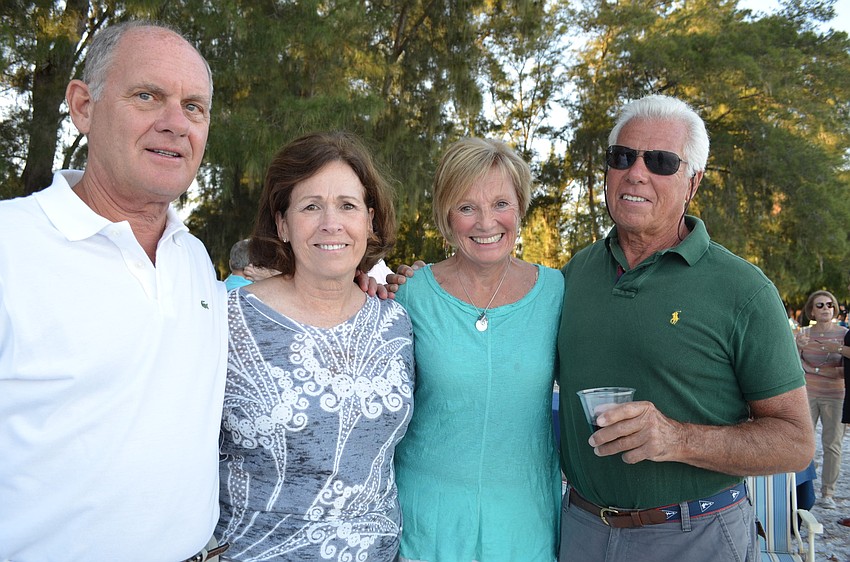 Members of the Bird Key Yacht Club Paul and Jane Cockrel with Carlene and Bob Baime attend a beach barbecue on Saturday evening.