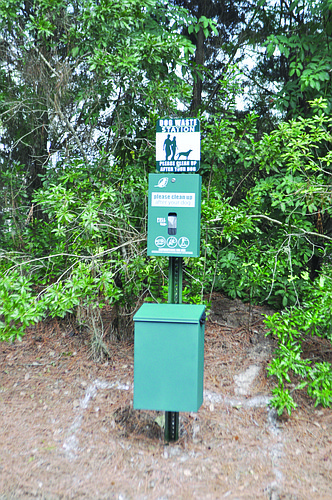 District 1 will be the home of 14 dog waste stations, like this one in District 2 on Arnold Palmer Green. be installed within the next month. Photo by Alex Rostowsky