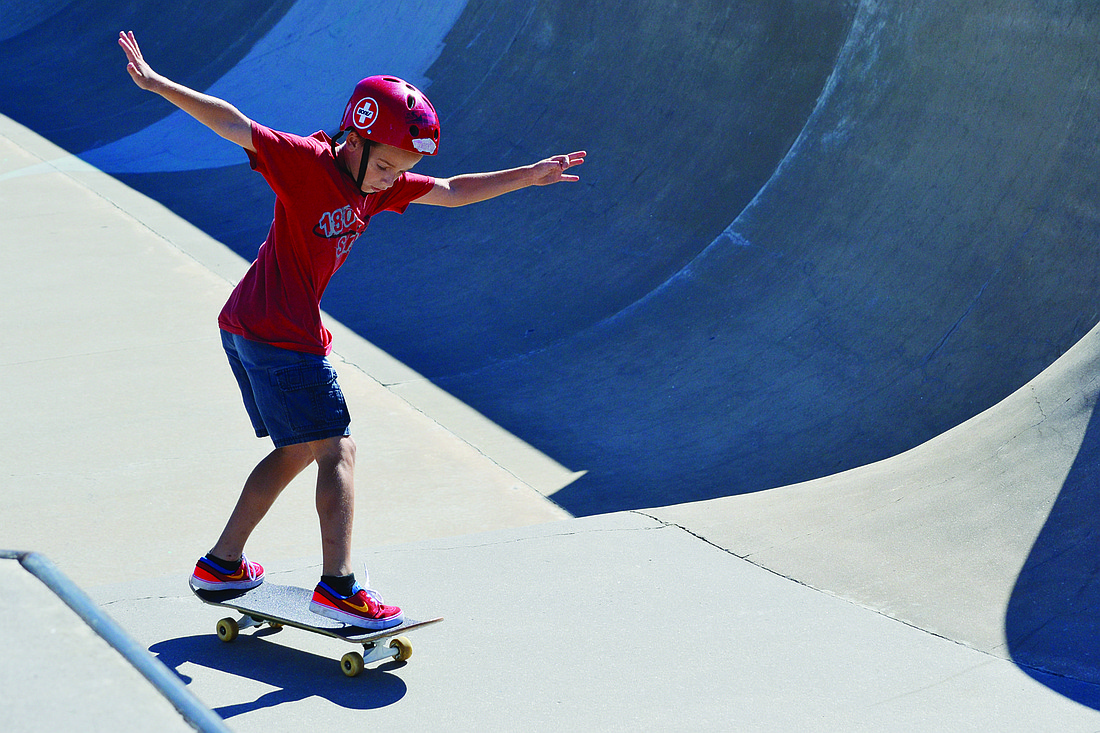 Hunter Soechtig takes a turn in the bowl Saturday, at the Payne Skate Park.